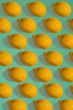Lemon pattern isolated on blue background. Flat lay Stock Photos