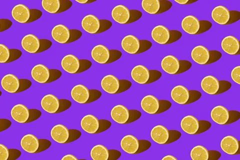Lemon pattern on purple background. Pop art design, creative citruses. Yellow Foto stock