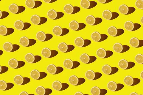 Lemon pattern on a yellow background. Pop art design, creative citruses. Yellow Stock Photos