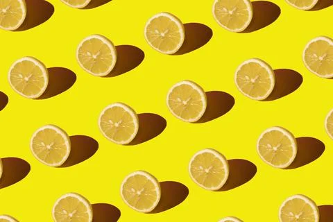 Lemon pattern on a yellow background. Pop art design, creative citruses. Yellow Stock Photos
