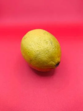 Lemon on a pink background Stock Photos