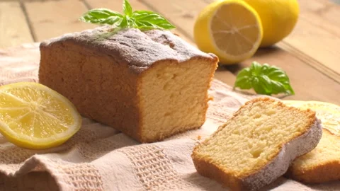 Lemon pound cake on rustic wooden background with lemon and mint. Stock Footage 159334877