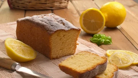 Lemon pound cake on rustic wooden background with lemon and mint. Stock Footage 159339054
