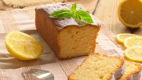 Lemon pound cake on rustic wooden background with lemon and mint. Stock Footage 159339736