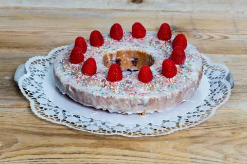 Lemon raspberry cake on rustic wood Stock Photos