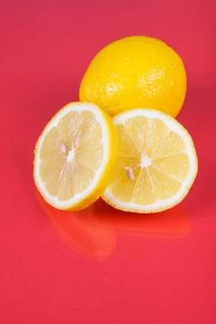 Lemon on red background Stock Photos
