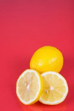 Lemon on red background Stock Photos