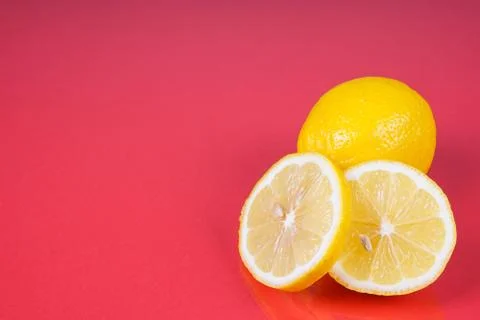 Lemon on red background Stock Photos