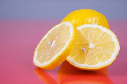 Lemon on red background Stock Photos