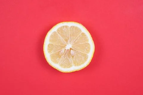 Lemon on red background Stock Photos