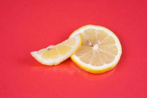 Lemon on red background Stock Photos