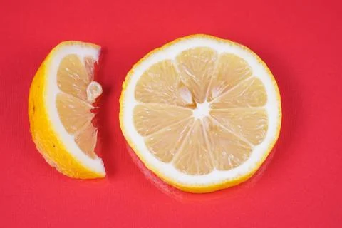 Lemon on red background Stock Photos