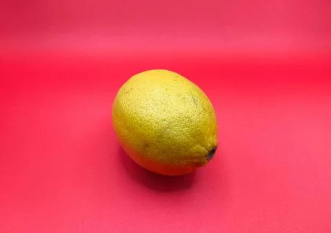 Lemon on a red background Stock Photos