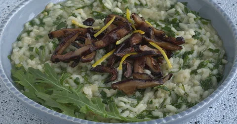Lemon risotto with arugula and fried shiitake mushrooms. Stock Footage 277281174