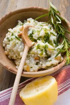 Lemon risotto with pine nuts, herb oil and rosemary 写真素材