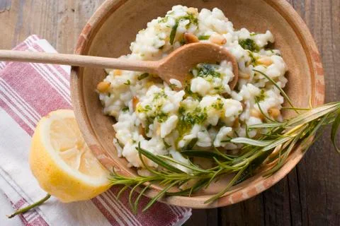 Lemon risotto with pine nuts, herb oil and rosemary 写真素材