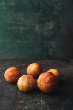 Lemon with rosy pulp on rustic background Foto stock