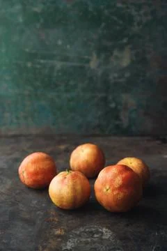 Lemon with rosy pulp on rustic background Stock Photos