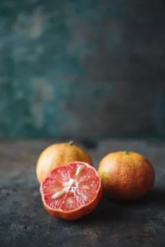 Lemon with rosy pulp on rustic background Stock Photos