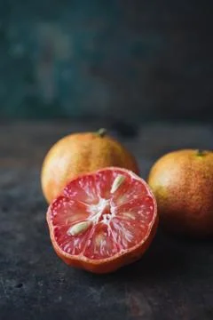 Lemon with rosy pulp on rustic background Stock Photos