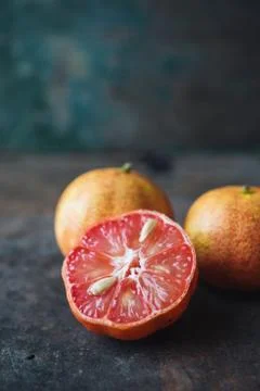 Lemon with rosy pulp on rustic background Stock Photos
