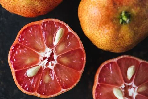 Lemon with rosy pulp on rustic background Stock Photos