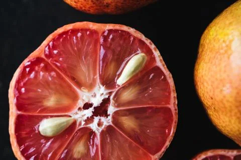 Lemon with rosy pulp on rustic background Stock Photos