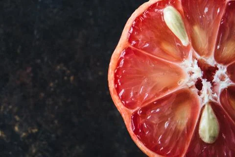 Lemon with rosy pulp on rustic background Stock Photos