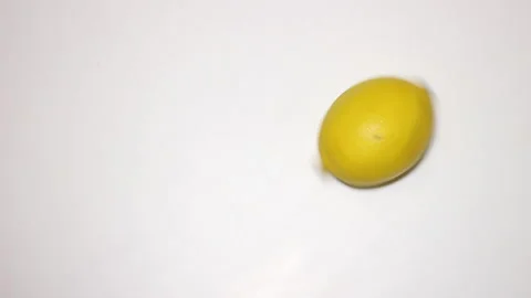 Lemon rotates on a white background Stockbeeldmateriaal 144134413