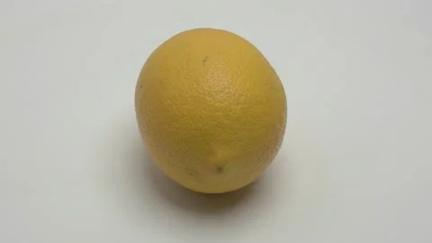 Lemon rotates on a white background. 스톡 동영상 265953647