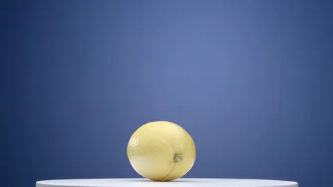 Lemon on a rotating table Stock Footage 99365032