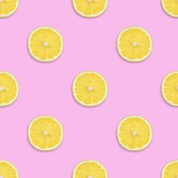 Lemon seamless pattern on a pink background. Tropical fruit seamless texture. Stock Photos