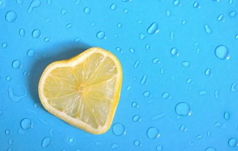 Lemon slice and dew drops Stock Photos