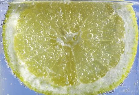 Lemon slice with bubbles Stock Photos