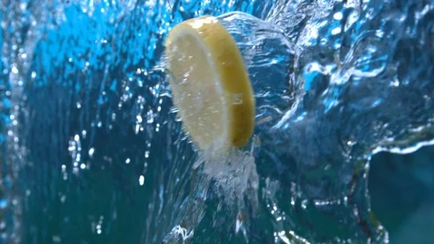 Lemon Slice Flying Through Water Cascade Splashing in slow Motion at 1500 fps Video stock 112224379