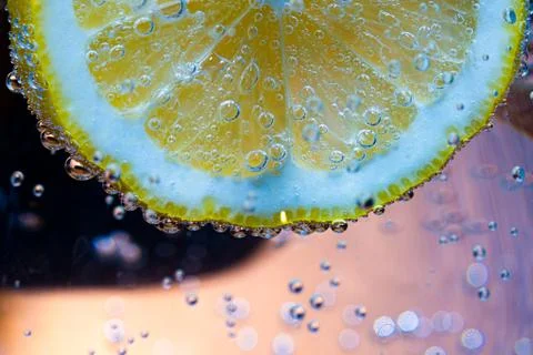 Lemon slice foating in soda Stock Photos