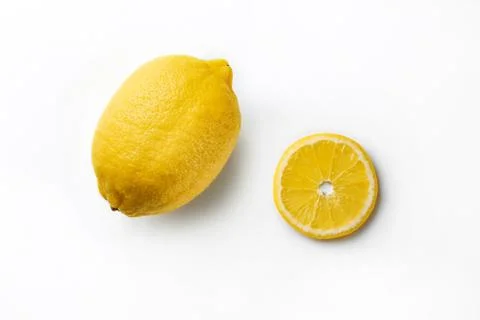 Lemon with a slice of lemon on a white background Foto stock