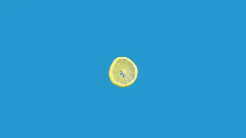 Lemon slice spinning around in loop motion Stock Footage 142313130