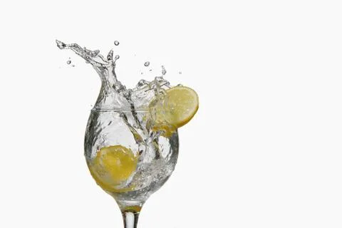 Lemon slice splash on white background Stock Photos
