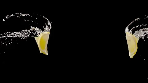 Lemon slice with water droplets collide on black background  super slow motion Stock Footage 116959551