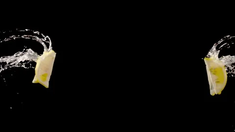 Lemon slice with water droplets collide on black background  super slow motion Stock Footage 116959657