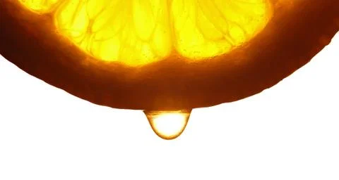 Lemon slice with a water droppings. Macro studio shot Stock Photos