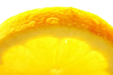 Lemon slice with a water droppings. Macro studio shot Stock Photos