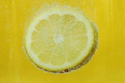 Lemon slice in water Stock Photos