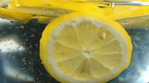Lemon slices are falling into the water. Stock Footage 113204656