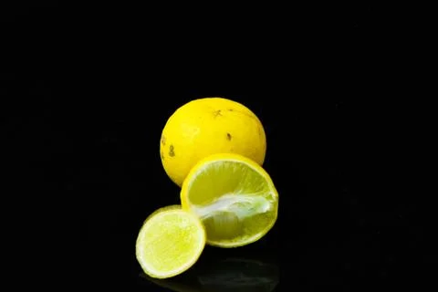 Lemon slices on black isolated background Stock-Fotos