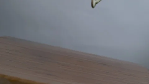 Lemon slices falling on chopping board in slow motion Stock Footage 100009161