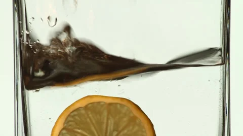 Lemon slices falling in water Stock Footage 49880636