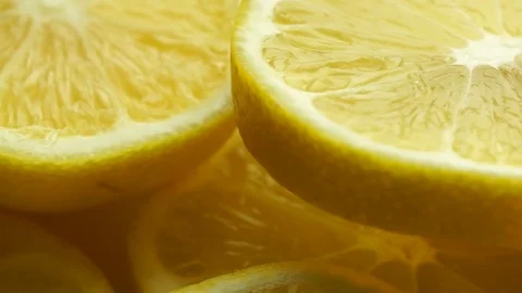 Lemon slices with mint leaf rotation background. Close-up of a delicious ripe Stock Footage 81025693