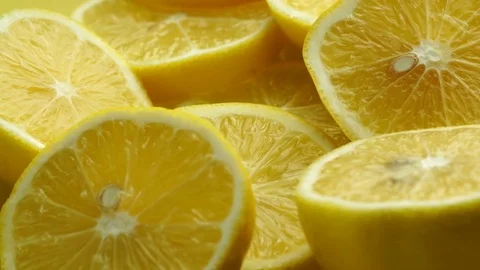 Lemon slices with mint leaf rotation background. Close-up of a delicious ripe Stock Footage 81031814
